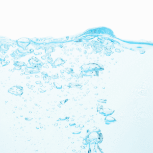 Ljusblå bakgrund med stigande bubblor som symboliserar Degas-läget i ASONIC ultraljudsrengörare.